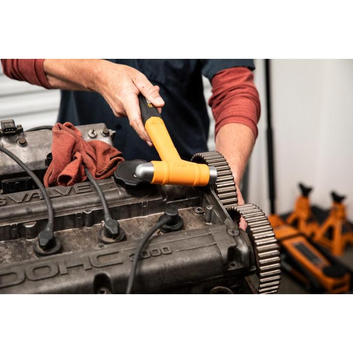 Image of the 16 oz. Dead Blow Ball Pein Hammer being used by a person on an engine block