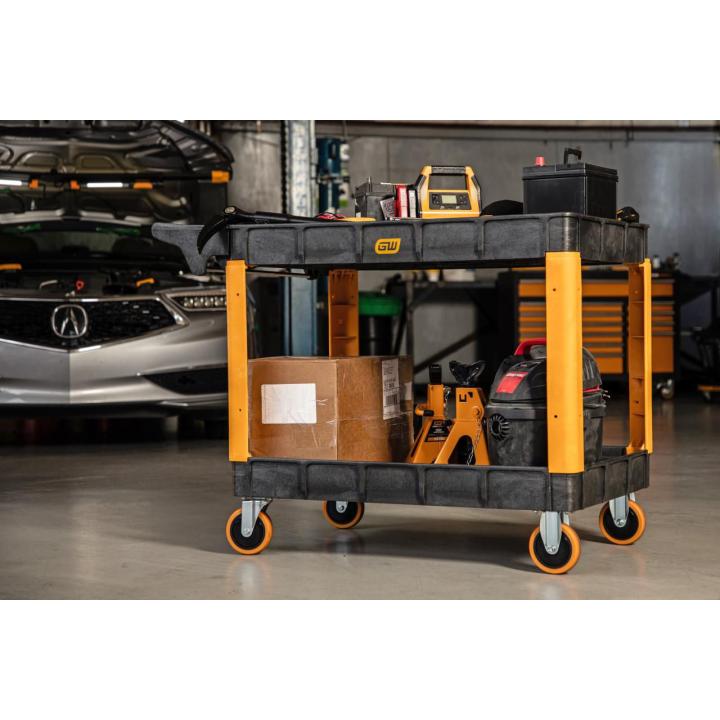 Image of the GWPSCM Heavy Duty Utility Cart in a garage shop setting showing the cart with packages on it.