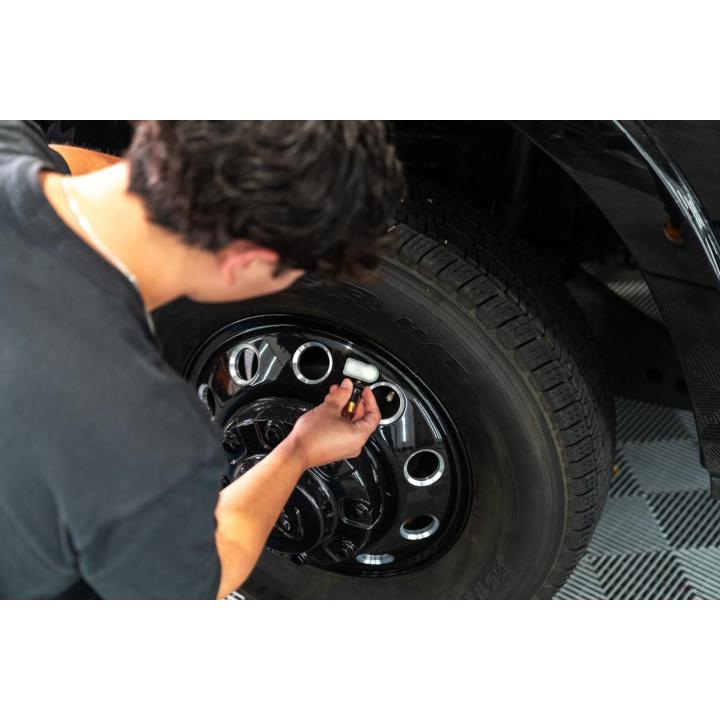 Image of the GWTPMSR being used by a mechanic on a car tire